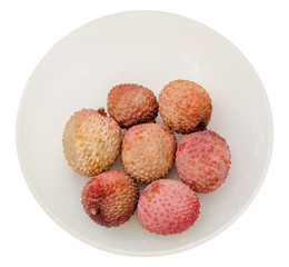 The lychee (Litchi chinensis) fruits in a transparent bowl