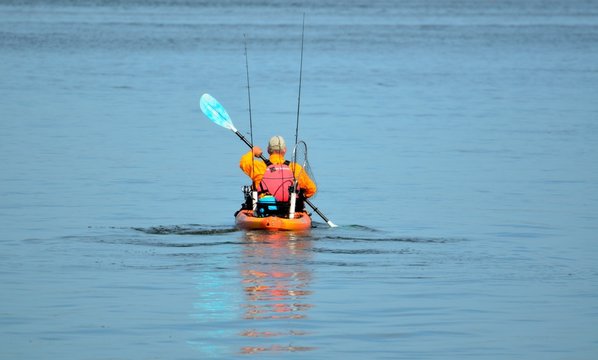 Fisherman kayaking on the river Florida, USA.