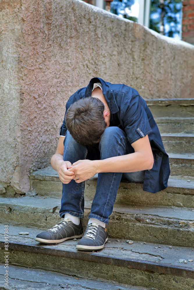 Wall mural sorrowful young man