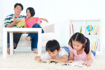 Fototapeta premium Asian family reading