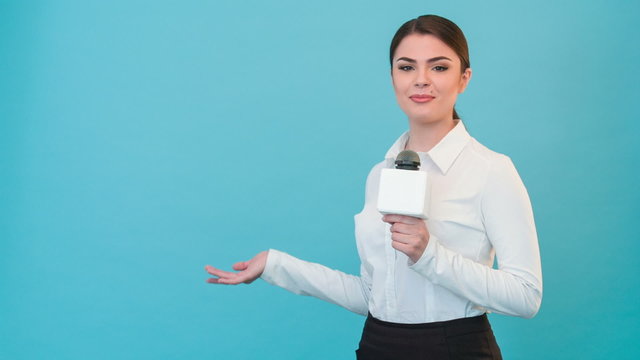 Beautiful girl TV journalist with pretty smile is reporting