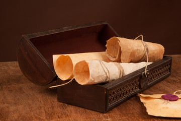 chest with old documents on table