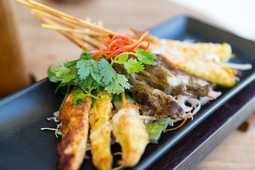 close up of deep-fried asian snacks on plate