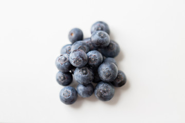 juicy fresh ripe blueberries on white