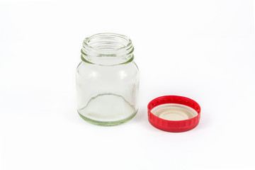 Glass bottle with red lid isolated on white background