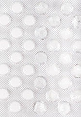 Background of blister with white pills