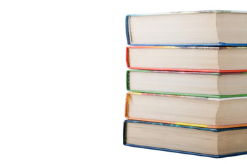 A stack of books in color covers isolated on white background. S