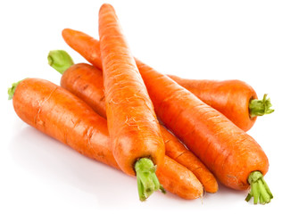 Fresh carrot with green leaves. Isolated on white background