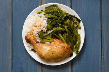 fried chicken with rice and bolied cabbage