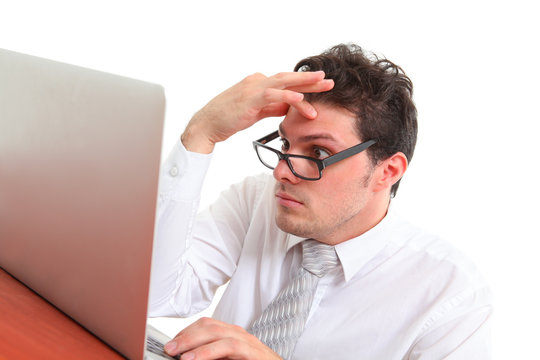 stressed out man with computer on white background