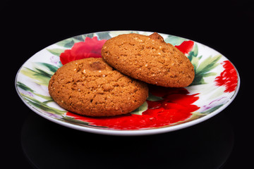 hot oatmeal on a black background with reflection