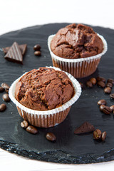 Chocolate muffins on a black tray