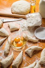 Fresh baked dough for bread or rolls and ingredients for cooking