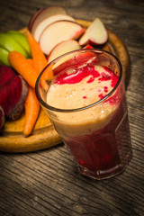 Glass of fresh beetroot, apple and carrot juice