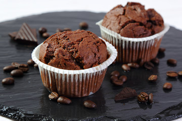 Chocolate muffins on a black tray