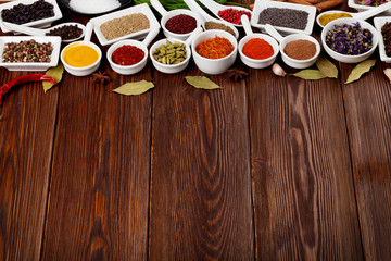 Various spices on wooden background