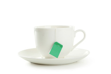 Cup of tea with tea bag isolated on white