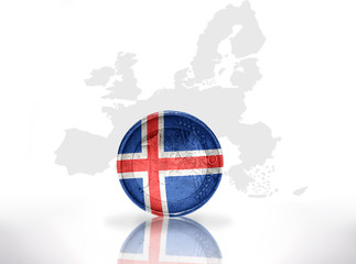 Naklejka premium euro coin with icelandic flag on the european union map