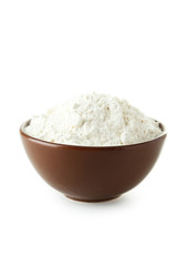 Bowl of wheat flour isolated on white