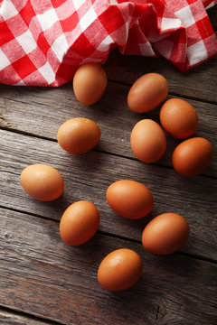 Chicken eggs on grey wooden background