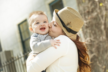 Fototapeta premium Young mother with her baby boy