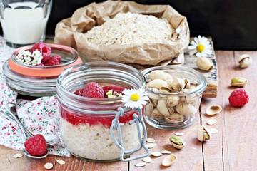 Overnight oats with fresh raspberry and pistachio. 