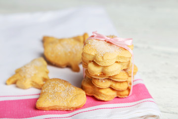 Cookies on napkin, on white wooden background