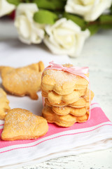 Cookies on napkin, on white wooden background