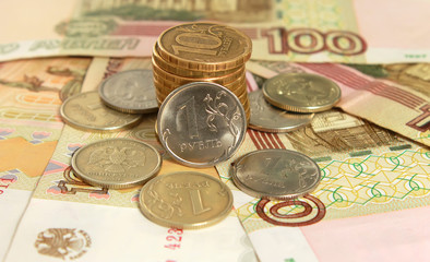 Russian coins and banknotes on the yellow background