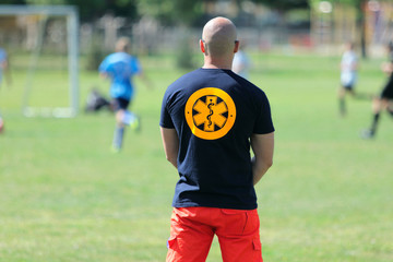 Paramedic for a football game of young boys