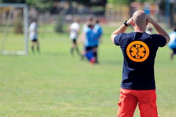 Paramedic for a football game of young boys