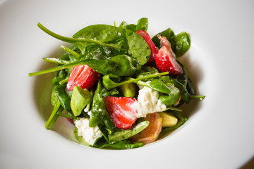 Fresh Salad with strawberries, goat cheese and shrimps