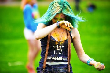 Portrait of happy young girl on holi color festival