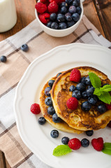Pancakes with forest fruit and mint