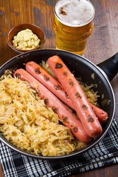 sausage with sauerkraut and beer glass
