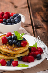 Pancakes with forest fruit and mint