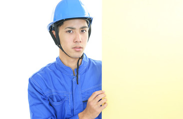 ボードを持つ労働者