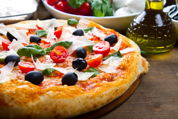 Delicious fresh pizza served on wooden table
