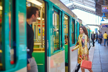 Young beautiful Parisian woman in subway