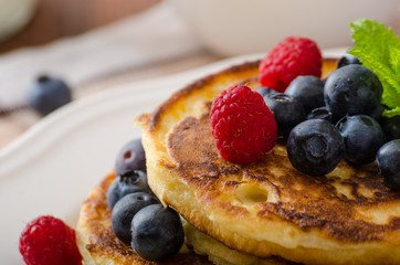 Pancakes with forest fruit and mint