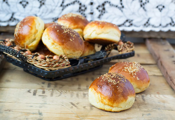 buns for burgers on wooden background
