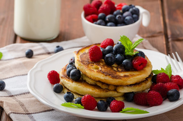 Pancakes with forest fruit and mint