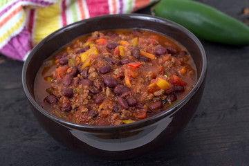 chili con carne beef chili on black table