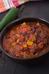 chili con carne beef chili on black table