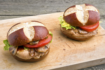 Grilled pork steak sandwich (burger) with mushrooms