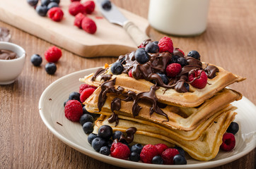 Homemade belgian waffles with fruit and chocolate