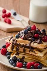 Homemade belgian waffles with fruit and chocolate