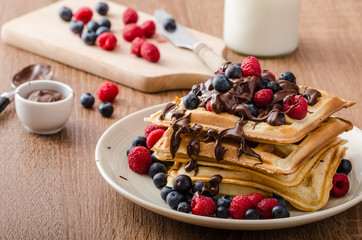 Homemade belgian waffles with fruit and chocolate