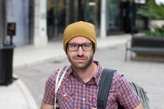 Trendy handsome man with eyeglasses in the street
