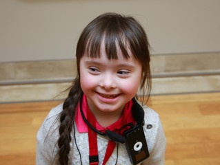 Portrait of beautiful happy girl in the museum.
